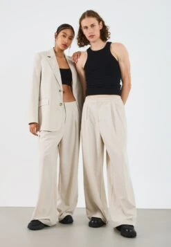 YOURTURN UNISEX - Trousers - Stone 13 YOURTURN UNISEX - Trousers - Stone -Yourturn Shop 55ebf272e89b49f784b44d60224af5b8