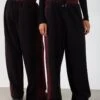 YOURTURN UNISEX - Tracksuit Bottoms - Black/red -Yourturn Shop cb2ccb517e044c62b65ad568fa989c53